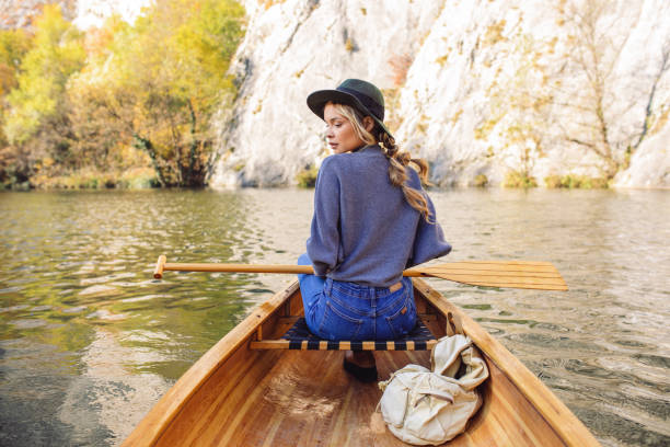 istock Woman enjoying perfect day on canoe 1351501965