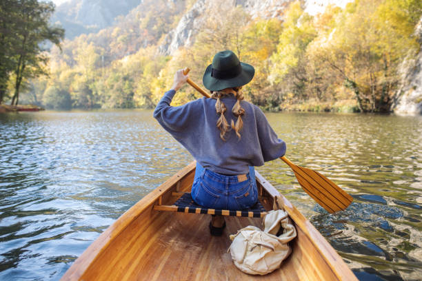 istock Woman enjoying perfect day on canoe 1351501971