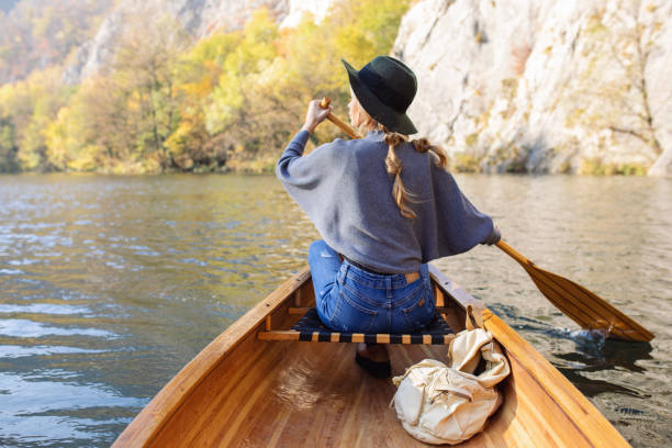 istock Woman enjoying perfect day on canoe 1351502019