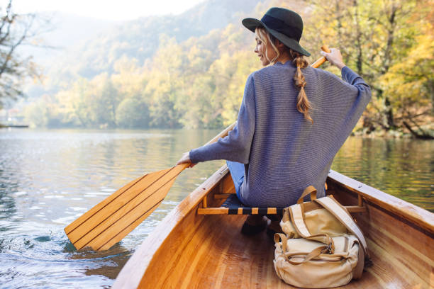 istock Woman enjoying perfect day on canoe 1351502036