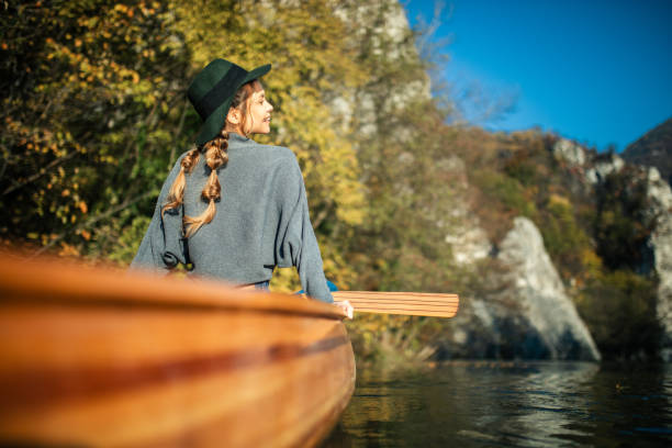 istock Woman enjoying perfect day on canoe 1351502122
