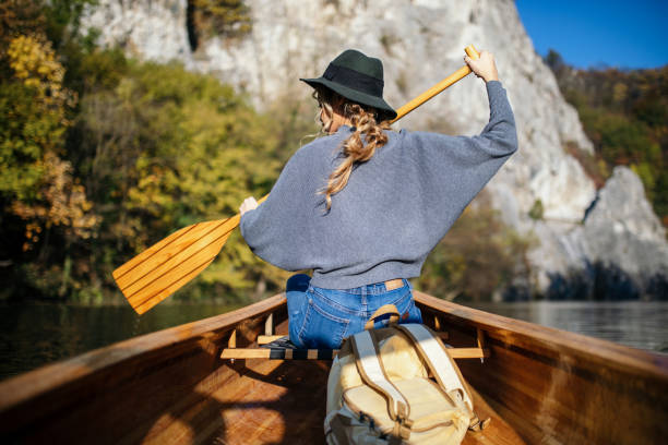 istock Woman enjoying perfect day on canoe 1351502150
