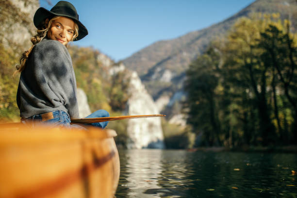istock Woman enjoying perfect day on canoe 1351502178