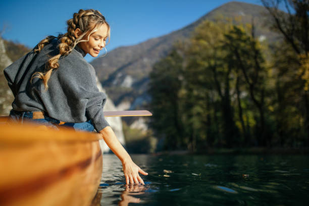 istock Woman enjoying perfect day on canoe 1351502199