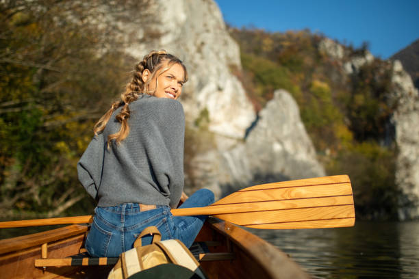 istock Woman enjoying perfect day on canoe 1351502234