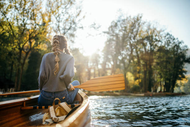 Woman enjoying perfect day on canoe
