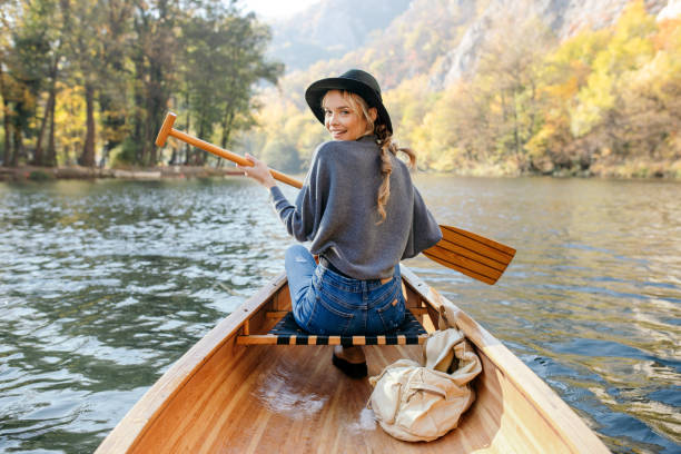 istock Woman enjoying perfect day on canoe 1351503710
