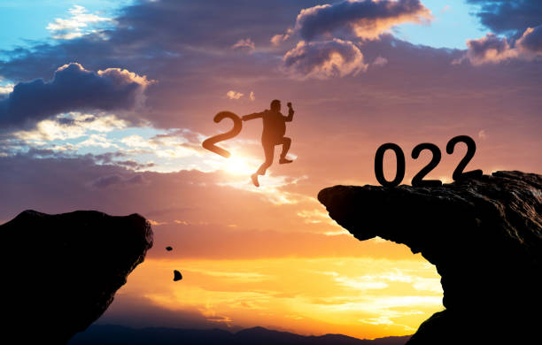 istock Businessman jumping to 2022 cliff 1351504042