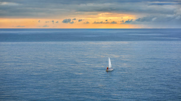 sailing ship in the sea against the blue sky.