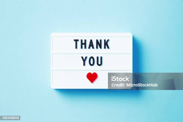 Thank You Written White Lightbox Sitting On Blue Background Stock Photo - Download Image Now