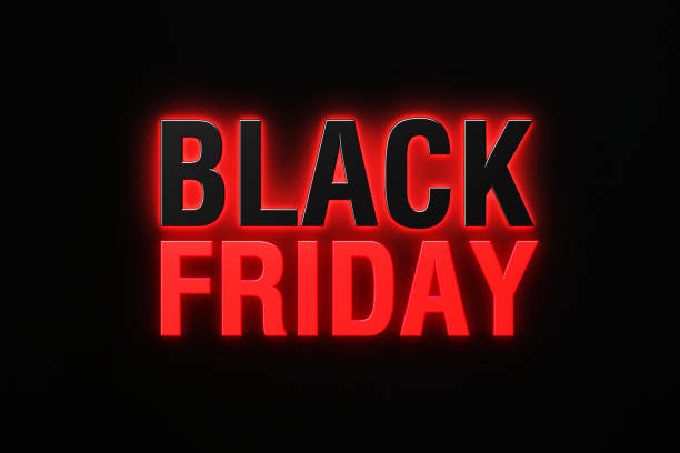 istock Black Friday Concept - Black And Red Glowing Letters Writing Black Friday Over Black Background 1351511243