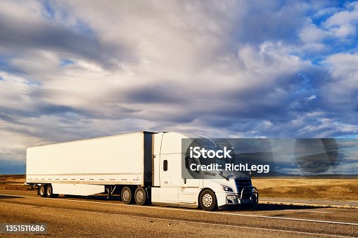 istock Long Haul Semi Truck On a Rural Western USA Interstate Highway 1351511686