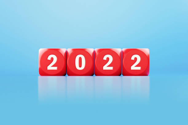 istock 2022 Concept - Red Dices With 2022 Engraving Sitting Over Blue Background 1351512684