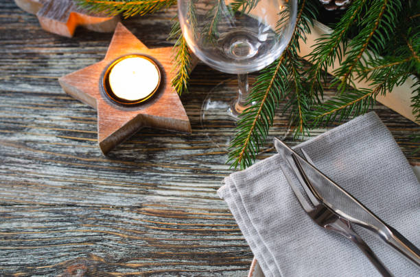 istock Christmas table setting with candles and fir branches 1351513011