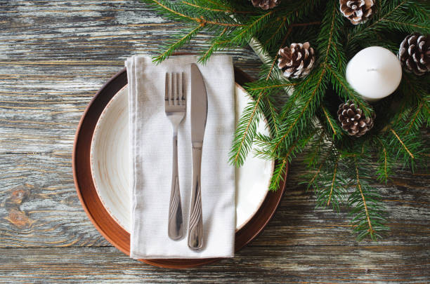 istock Christmas table setting with candles and fir branches 1351513092