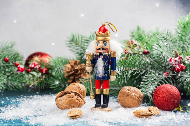 Christmas nutcracker toy soldier Christmas nutcracker toy soldier on Christmas background with fir tree branches, nuts, xmas balls. Christmas of New Year Greeting Card. Copy space toy soldier stock pictures, royalty-free photos & images