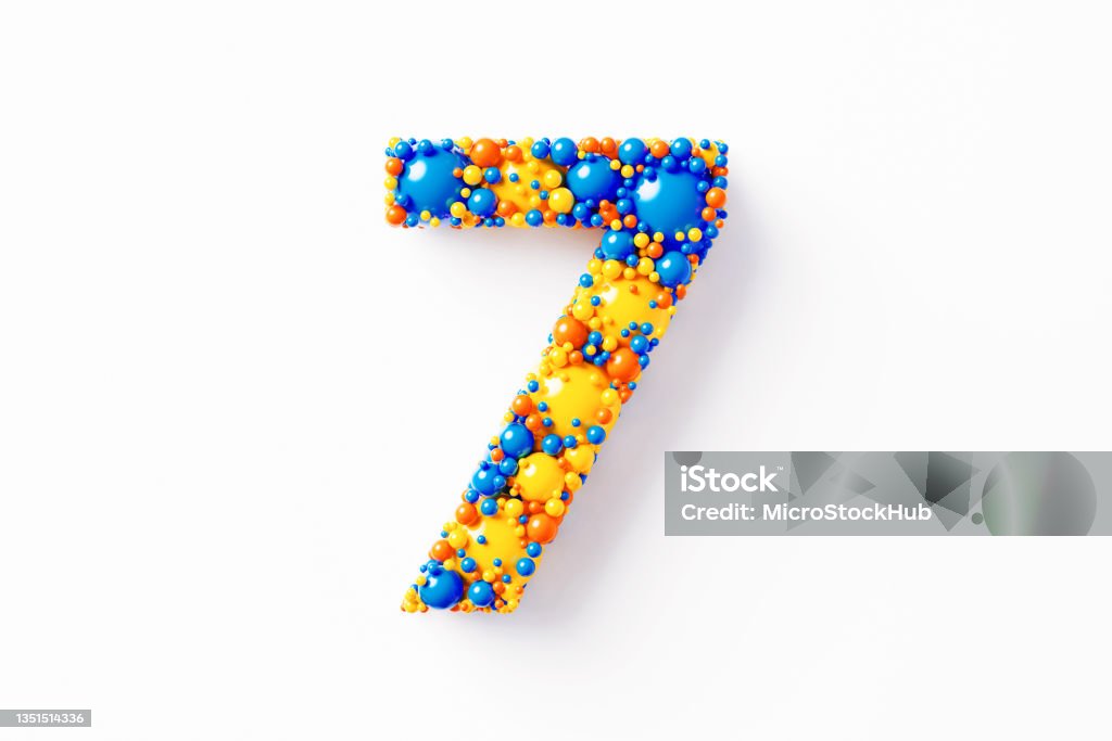 Colorful Number 7 Sitting On White Background Colorful number 7 made of many spheres sitting on white background. Horizontal composition with clipping path and copy space. Directly above. Abstract Stock Photo