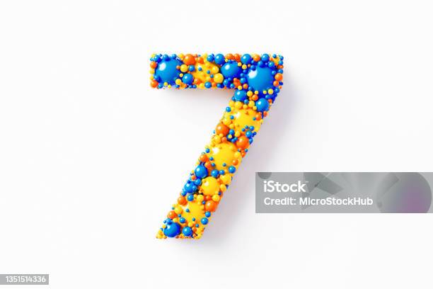 Colorful Number 7 Sitting On White Background Stock Photo - Download Image Now - Abstract, Number 7, Blue