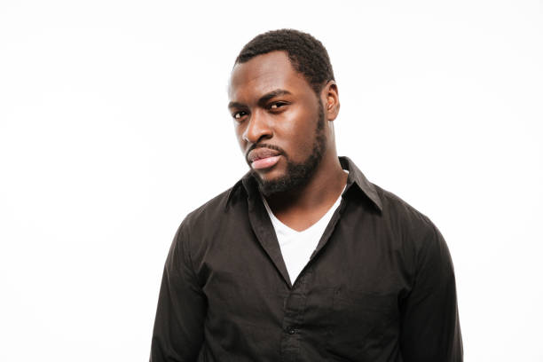 istock Serious young african man dressed in shirt isolated 1351517179