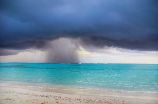 Beach against the backdrop of storm clouds over the ocean