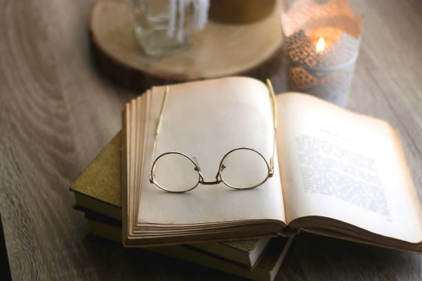 istock Books, Glasses and Candles 1351517967