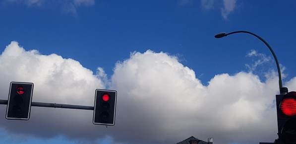 Clouds over city traffic lights