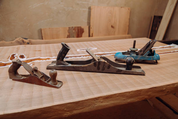 istock Old jointer planes laying on wood table 1351520477