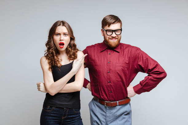 istock Shocked woman with smiling male nerd 1351521919