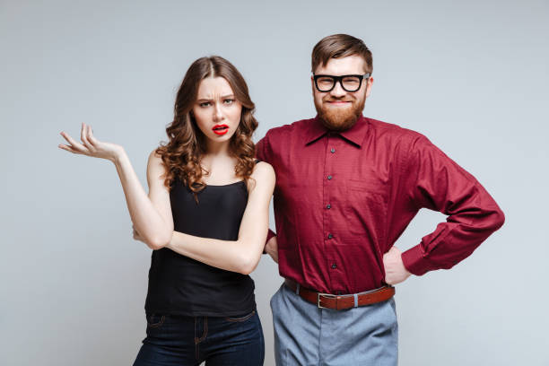 istock Surprised woman with smiling male nerd 1351522597
