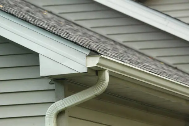 Photo of House Gutter Downspout Roof Soffit Siding Fascia