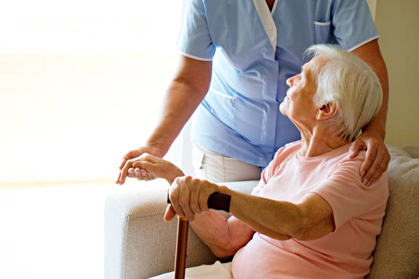 istock Senior lady with professional caregiver. 1351530663