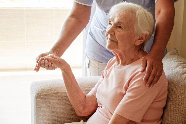 istock Senior lady with professional caregiver. 1351530666