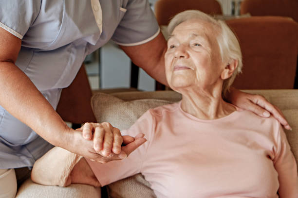 istock Senior lady with professional caregiver. 1351530713