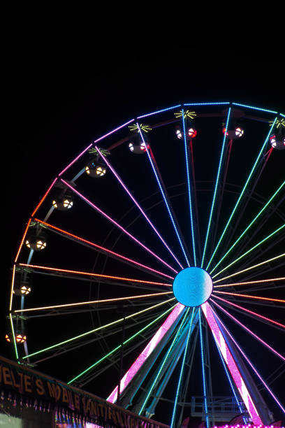 istock Fairground rides at night time 1351530911