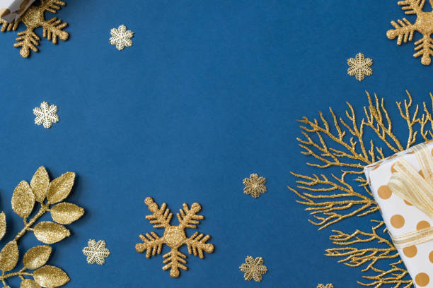 istock Christmas holiday composition. Flat lay frame with christmas balls and gift box on a blue background 1351533382
