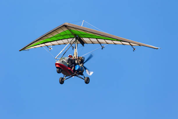 istock Flight on a motorized paraglider in mountainous terrain 1351534651