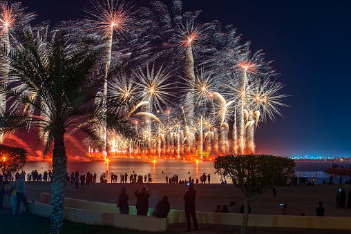Amazing New Years eve celebration firework show above the seaside coast in Marjan Island in Ras al Khaimah emirate of United Arab Emirates aerial view