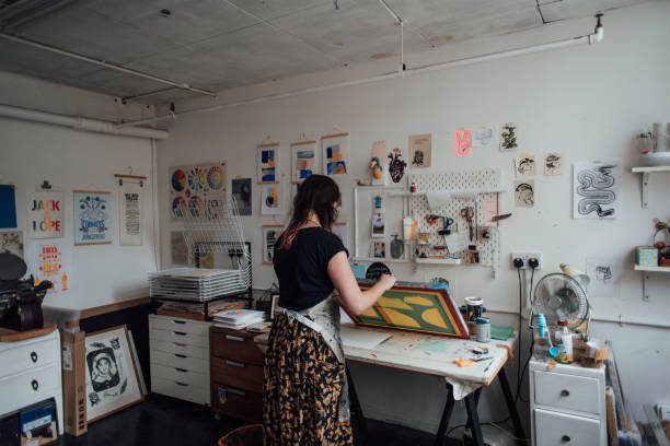 istock Artist and Printmaker working in her studio 1351539265