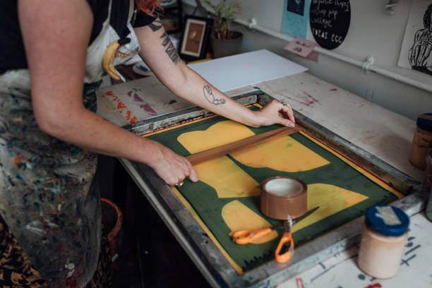 Artist and Printmaker working in her studio stock photo