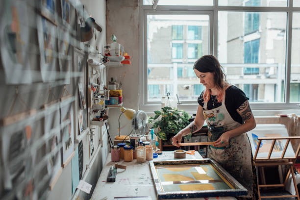 istock Artist and Printmaker working in her studio 1351540615