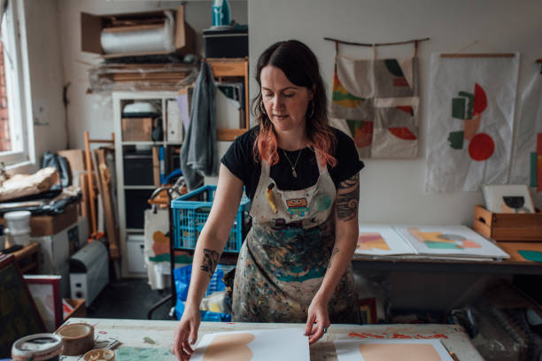 istock Artist and Printmaker working in her studio 1351540617