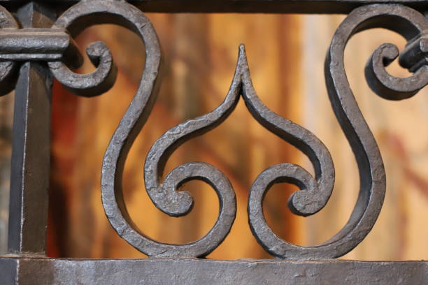 istock Vintage wrought iron fence close-up on a blurred background 1351540919