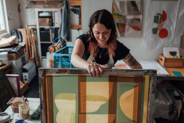 istock Artist and Printmaker working in her studio 1351540947