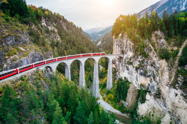 train crossing bridge, switzerland - viaduct stockfoto's en -beelden