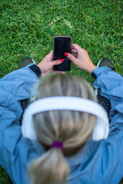 istock Sporty Woman Using Phone. 1351541109