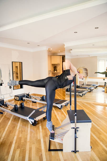istock Woman performing the pilates exercise 1351541171