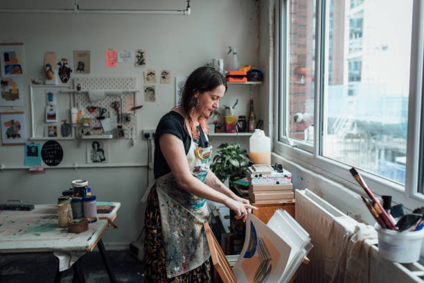 istock Artist and Printmaker working in her studio 1351541207