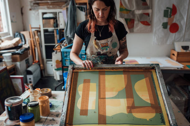 istock Artist and Printmaker working in her studio 1351542126
