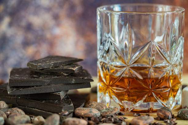 istock Whiskey, chocolate pieces and cocoa beans. 1351544594