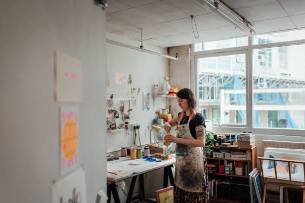 istock Artist and Printmaker working in her studio 1351544827